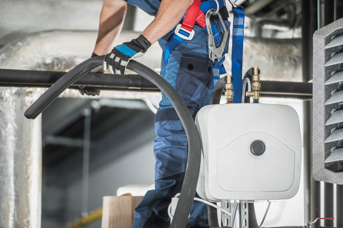 An HVAC specialist from McDonough HVAC Services doing some HVAC maintenance.